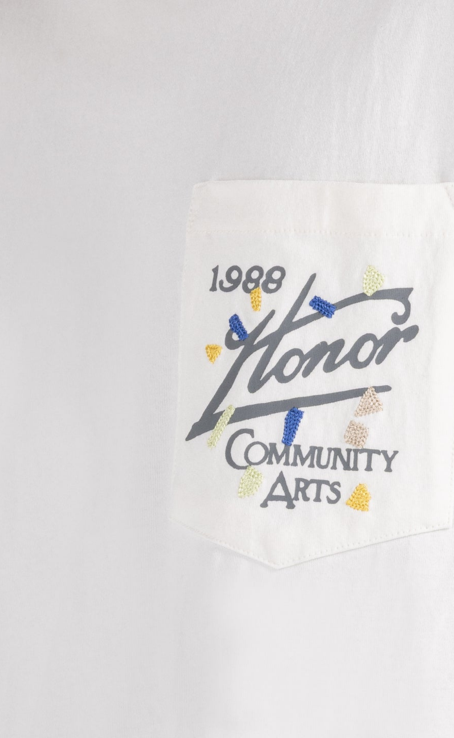 COMMUNITY ARTS WHITE T-SHIRT