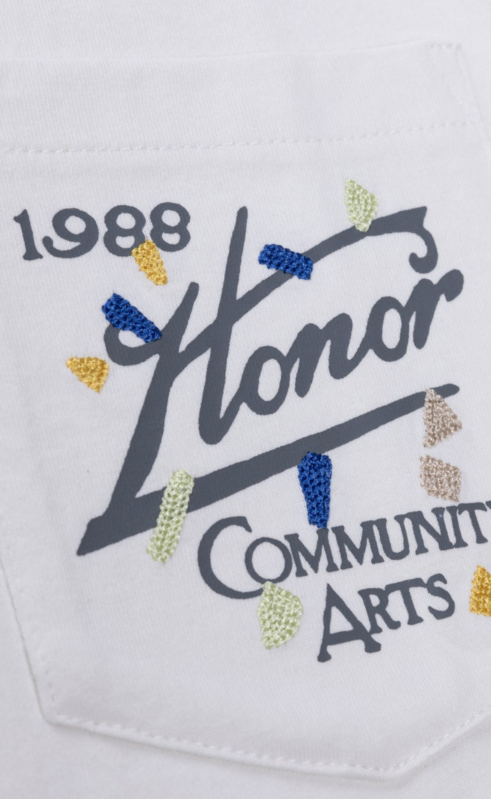 COMMUNITY ARTS WHITE T-SHIRT